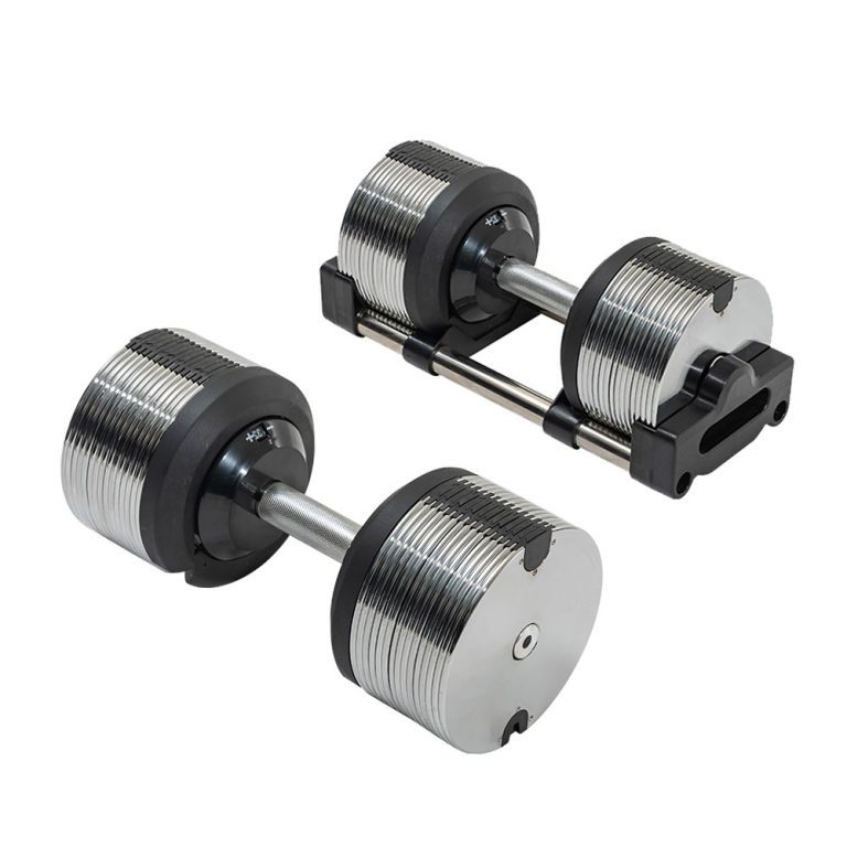 Adjustable stainless steel dumbbells with cast iron plates on gym floor.