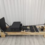 Our foldable Pilates reformer is the ultimate solution for a home fitness studio. Made with high-quality maple wood and a durable PU surface, this portable gym bed offers a professional workout experience that helps you build strength and tone your body with ease.