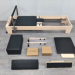 Our foldable Pilates reformer is the ultimate solution for a home fitness studio. Made with high-quality maple wood and a durable PU surface, this portable gym bed offers a professional workout experience that helps you build strength and tone your body with ease.